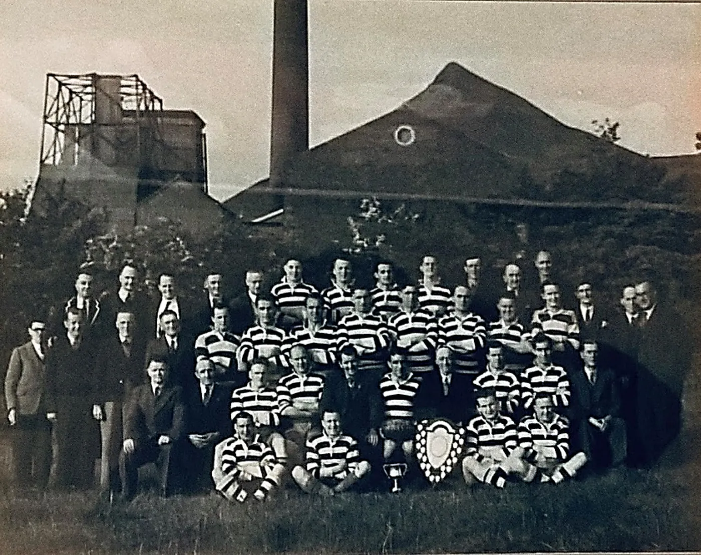 Tumble RFC, West Wales Cup champions 1945-46, in black and white hoops with the trophies